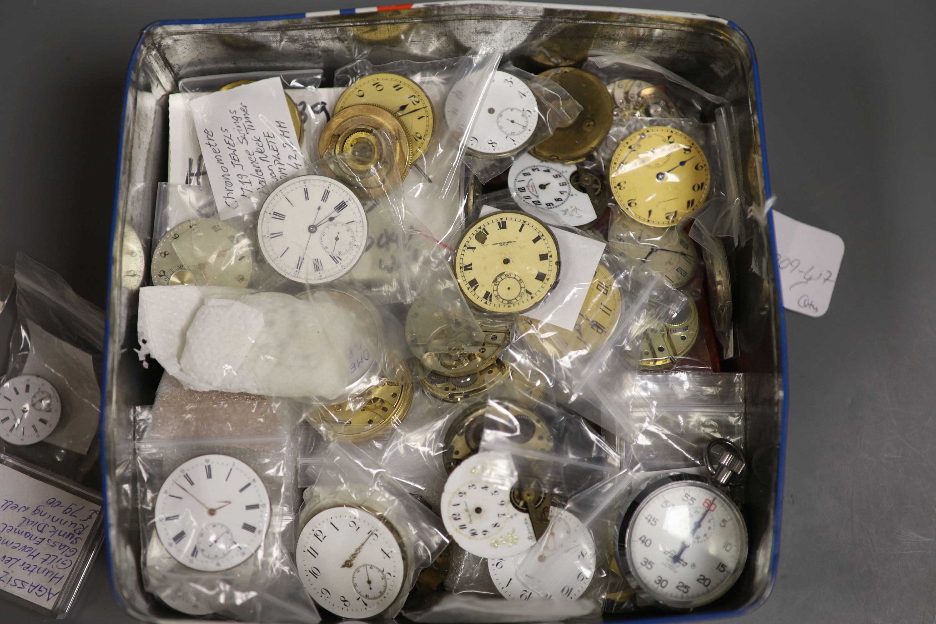 A large quantity of assorted pocket watch movements accessories and parts, etc.